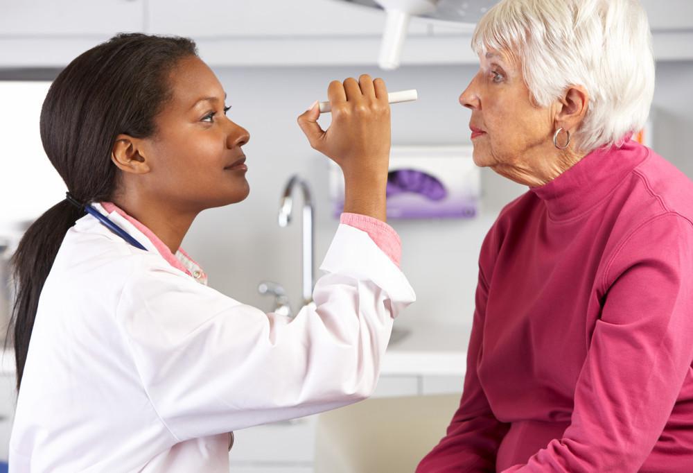 Older woman having her eyes examined