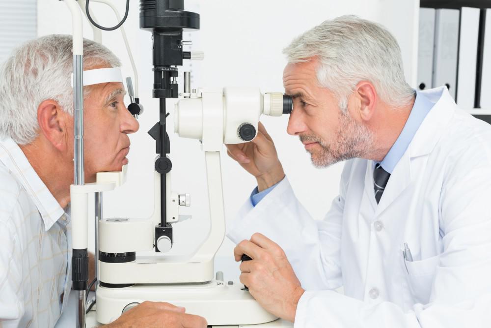 Older man having his eyes examined