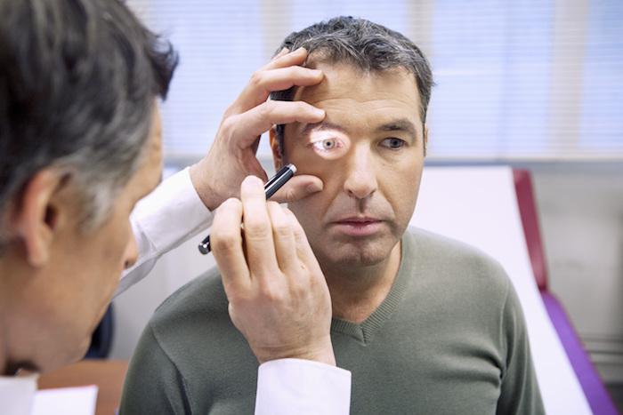 Man having his eye examined