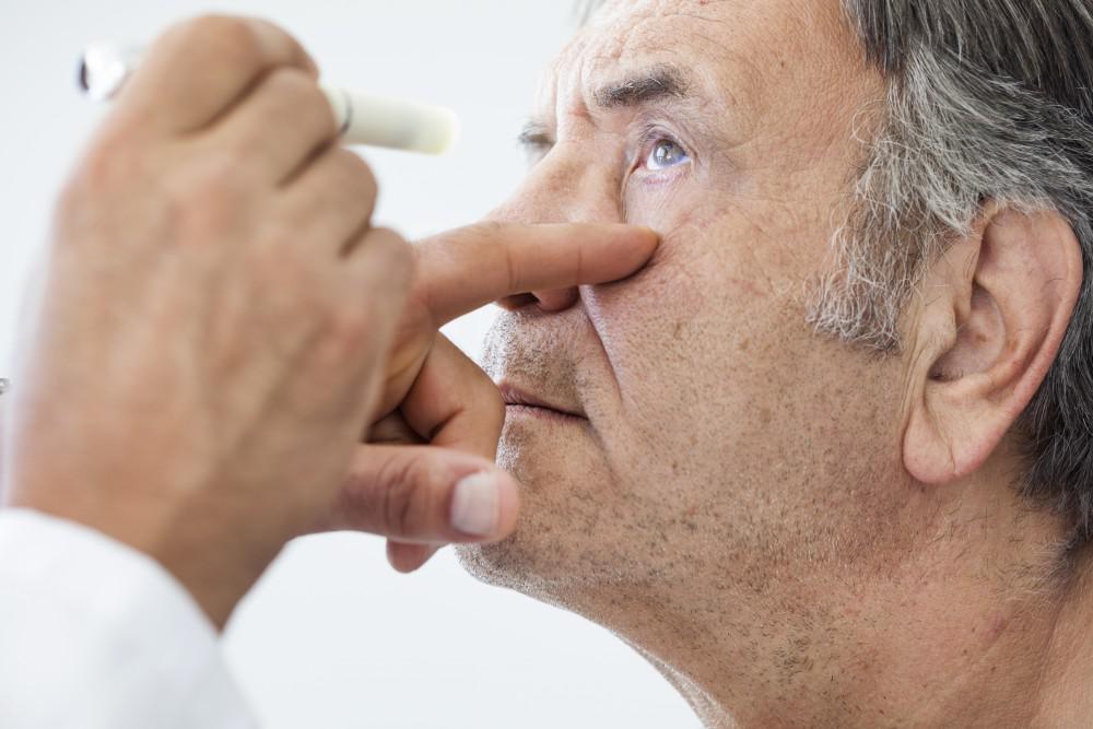 Older man having his eyes examined